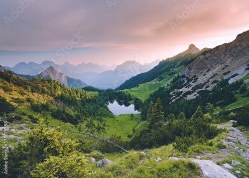 Little mountain lake in the Italian Alps, Lago Bordaglia, Friuli Venezia Giulia, Italy. Alpine forest lake valley 