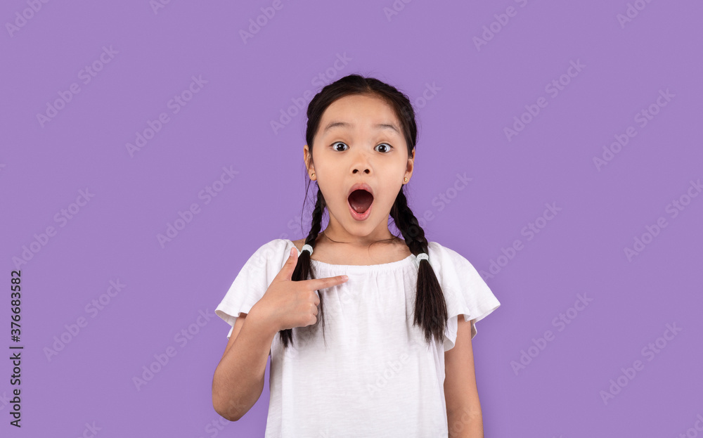 Chinese Little Girl Pointing At Herself Posing Over Purple Background Chinese Little Girl Pointing At Herself Posing Over Purple Background