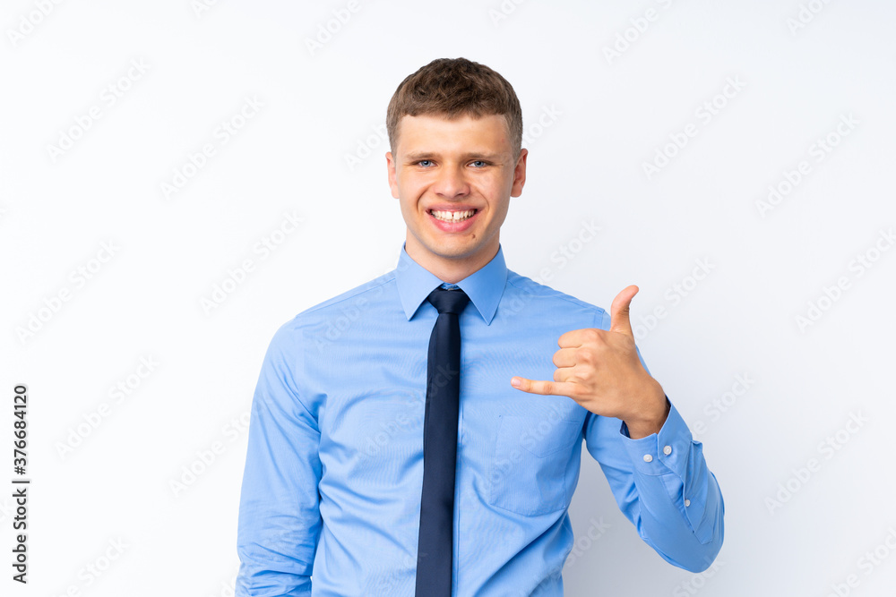Young handsome businessman making phone gesture Young handsome businessman making phone gesture