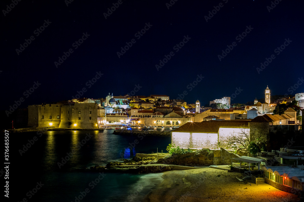Panoramic wide cityscape scene, long exposure at night. Scenery winter view of Mediterranean old city of Dubrovnik, European travel and historic destination, Croatia