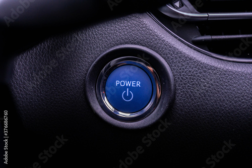 Close up engine car start button. Start stop engine modern new car button,Makes it easy to turn auto mobile on and off. a key fob unique ,selective focus © Muanpare