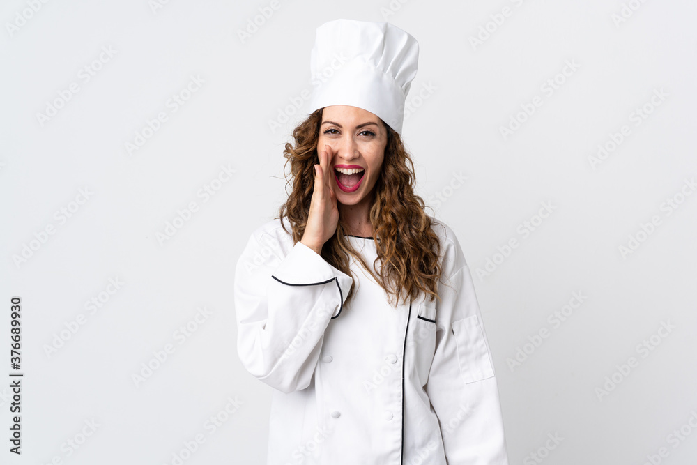 Young chef woman isolated on white background shouting with mouth wide open Young chef woman isolated on white background shouting with mouth wide open
