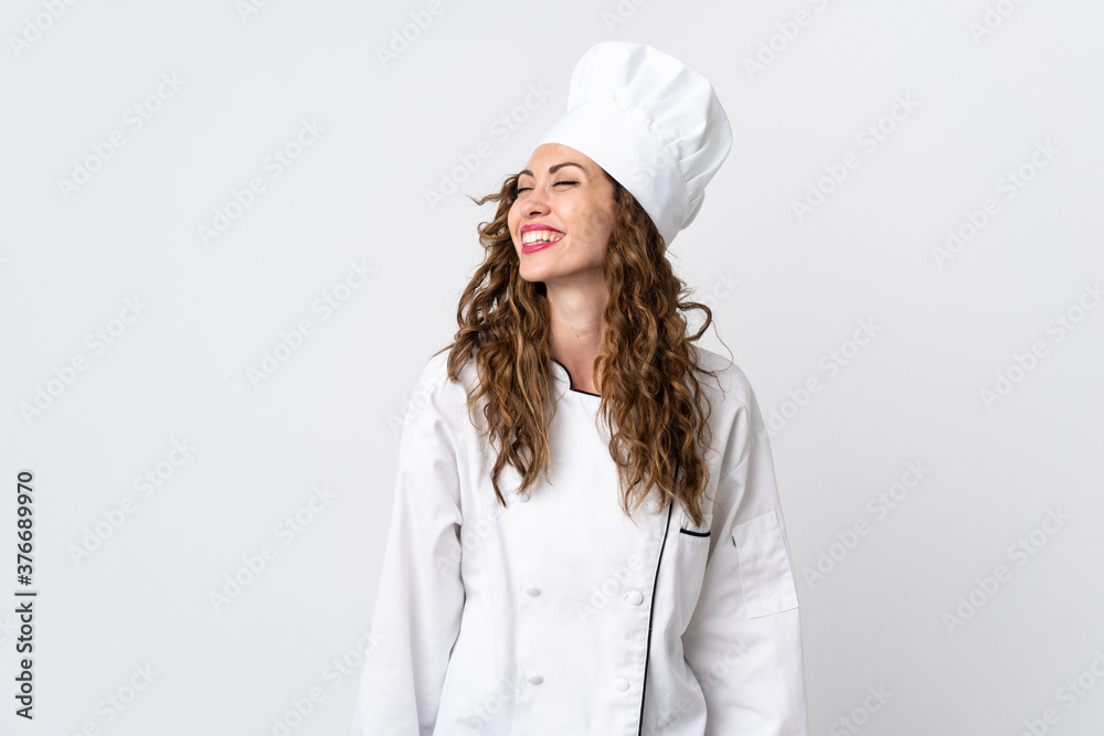 Young chef woman isolated on white background laughing Young chef woman isolated on white background laughing