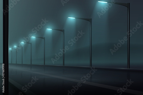 Road with lanterns and fog