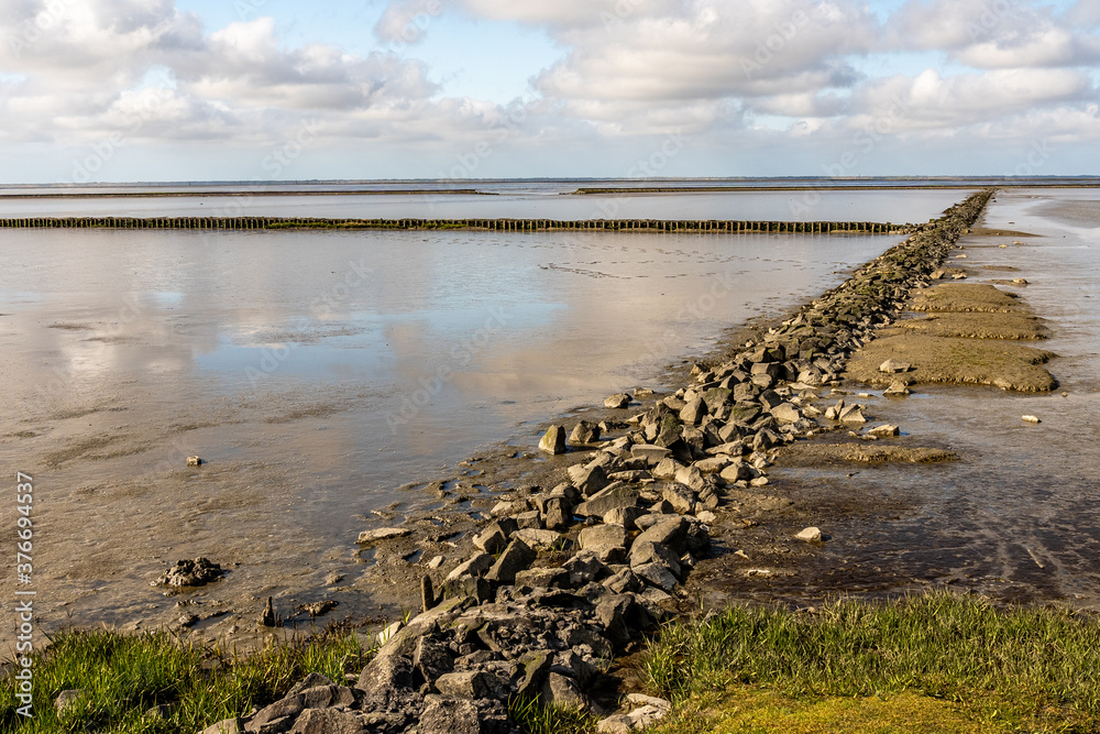 view on the wadden sea of the north sea at low tide near emden
