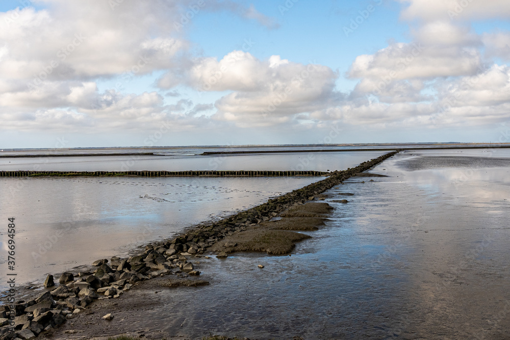 view on the wadden sea of the north sea at low tide near emden