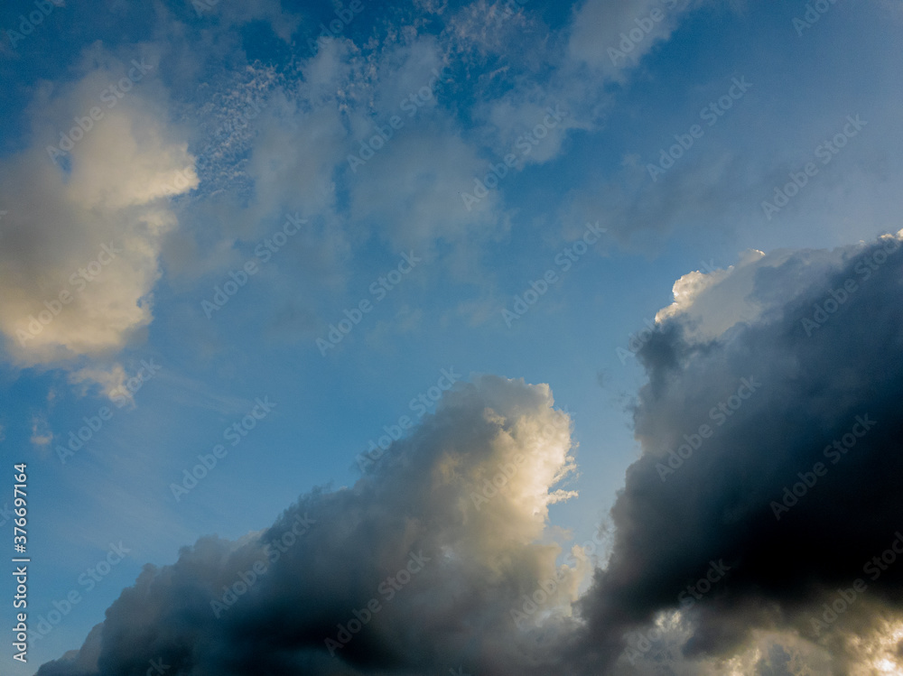 The deep blue sky with storm clouds