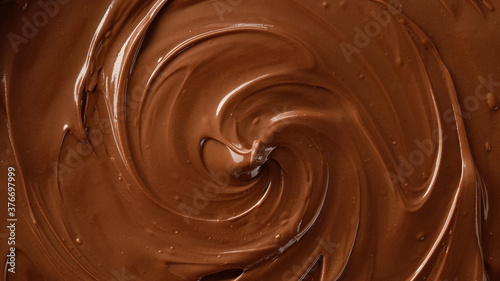 Bild auf Leinwand melted milk chocolate top view rotating