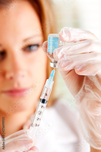 Flu: Drawing Vaccine Into Syringe