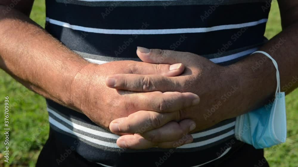Praying hands of christian man praying in Cathedral. Catholic man