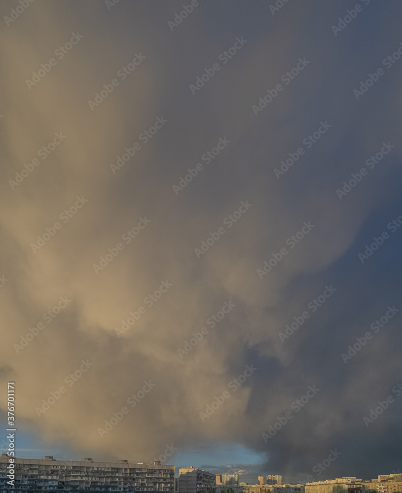 Sky with clouds over apartment buildings of the urban district. Panorama of the morning cityscape. Moscow city, Russia. Sky with clouds over apartment buildings of the urban district. Panorama of the morning cityscape. Moscow city, Russia.