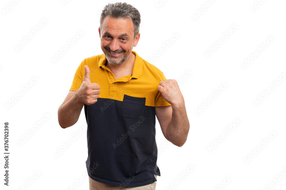 Cheerful man presenting tshirt making thumb-up like gesture Cheerful man presenting tshirt making thumb-up like gesture