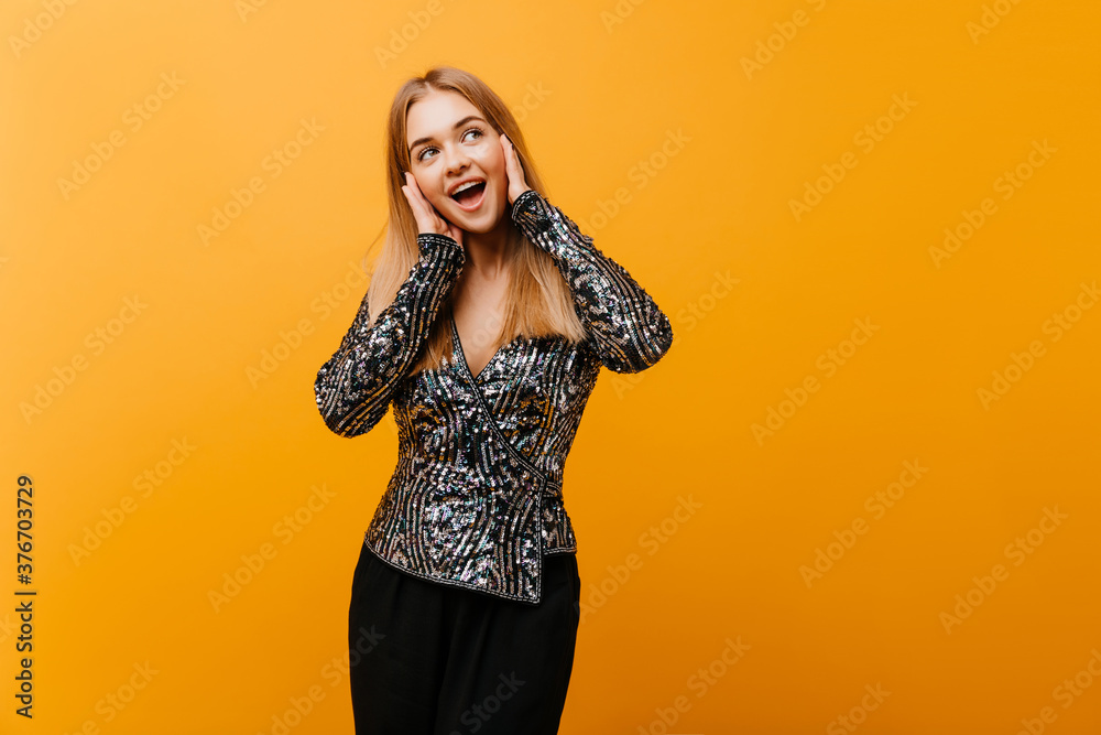 Pretty shapely woman posing with happy smile. Indoor portrait of cute european girl in elegant party outfit. Pretty shapely woman posing with happy smile. Indoor portrait of cute european girl in elegant party outfit.