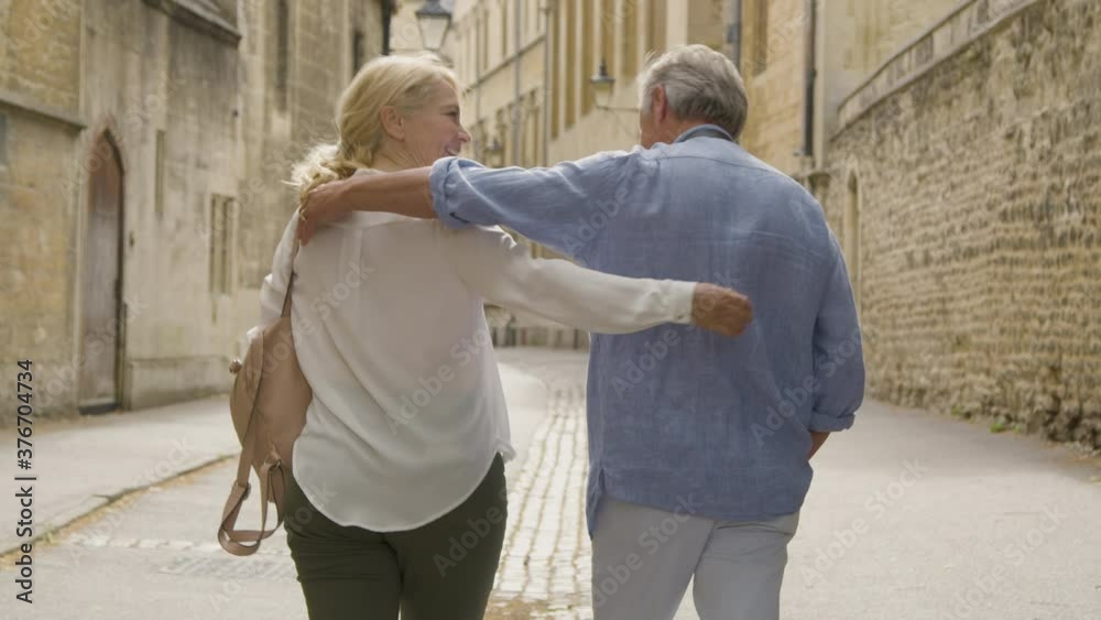 Medium Tracking Shot of Happy Middle Aged Couple Enjoying Oxford Medium Tracking Shot of Happy Middle Aged Couple Enjoying Oxford
