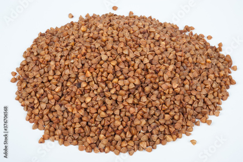 a pile of buckwheat on a white background