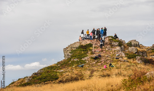 Fotografie Nature landscape for climbing and adventure, croup of people have climbed on top of the hill