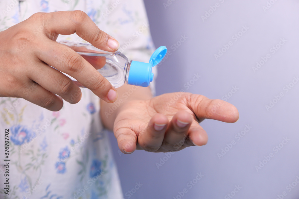 women hand using sanitizer gel for preventing virus with copy space women hand using sanitizer gel for preventing virus with copy space