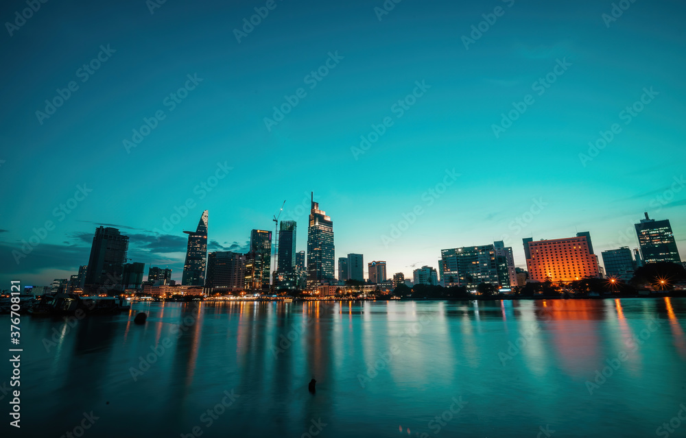 Fototapeta premium Bitexco Financial Tower building, buildings, roads, Thu Thiem 2 bridge and Saigon river in Ho Chi Minh city - This city is a popular tourist destination of Vietnam.
