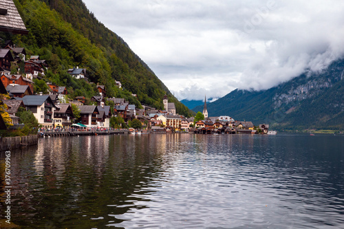 Beautiful landscape view of the Hallstatt from lake Hallstater See, Austria cloudy sky