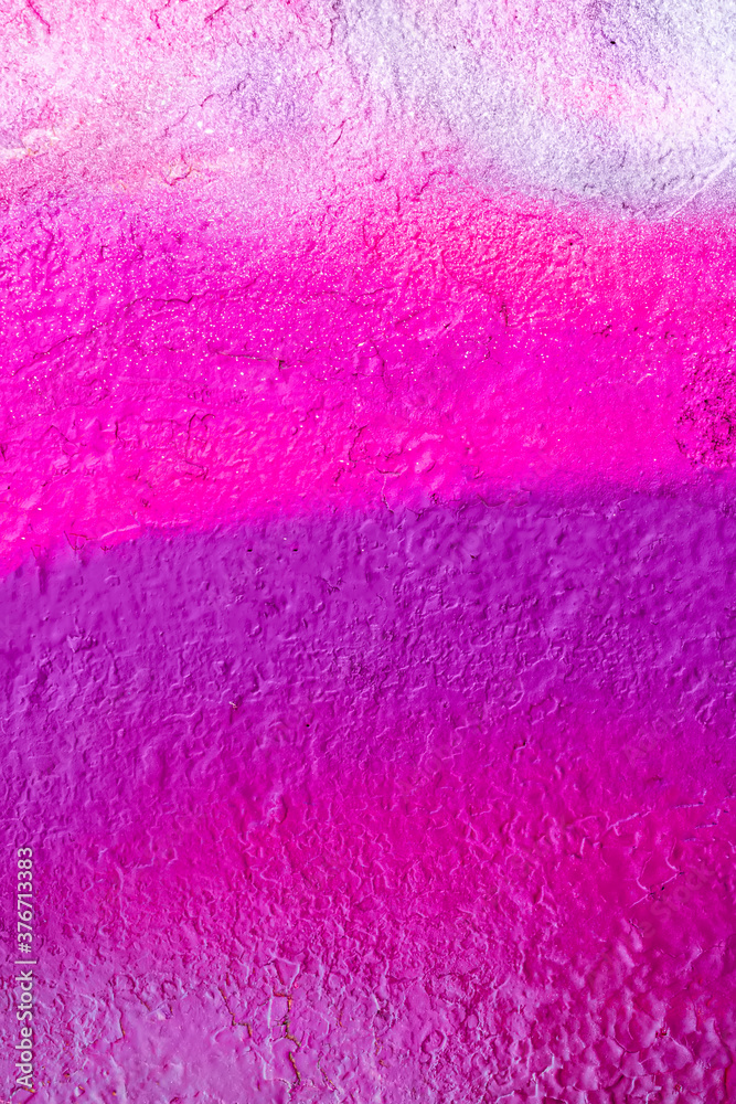 Beautiful bright colorful street art graffiti background. Abstract creative spray drawing fashion colors on the walls of the city. Urban Culture, orange , pink , purple , crimson, blue texture