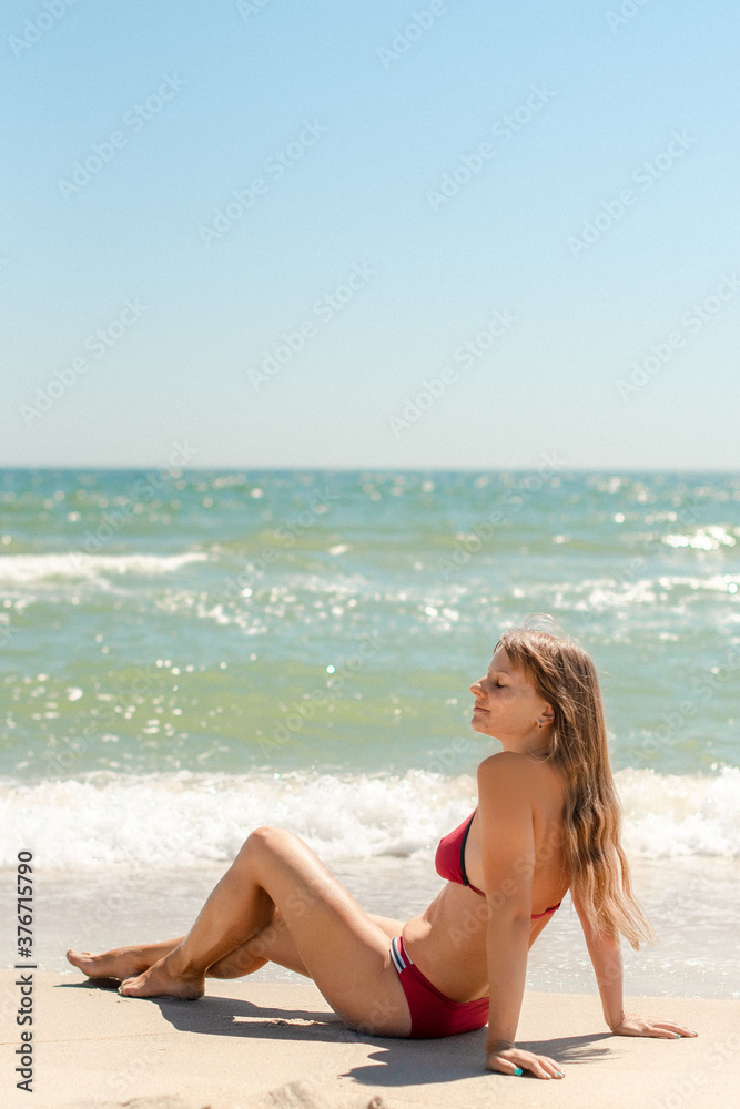 young woman walking on the beach young woman walking on the beach