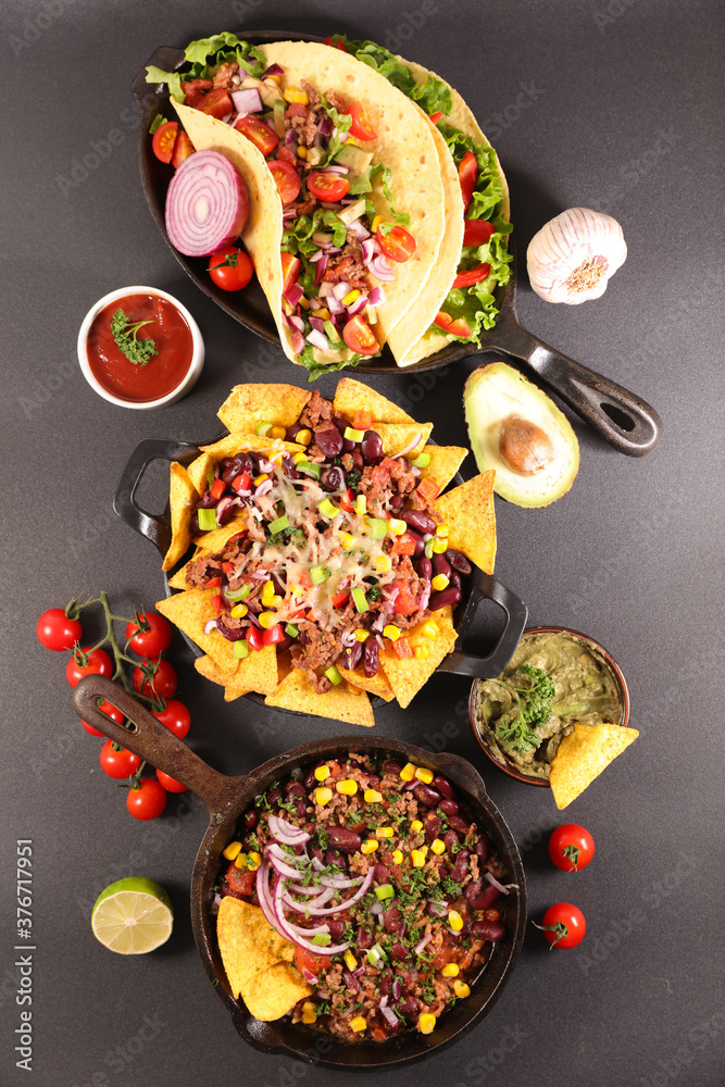 assortment of mexican dish- fajita,chili con carne, nachos