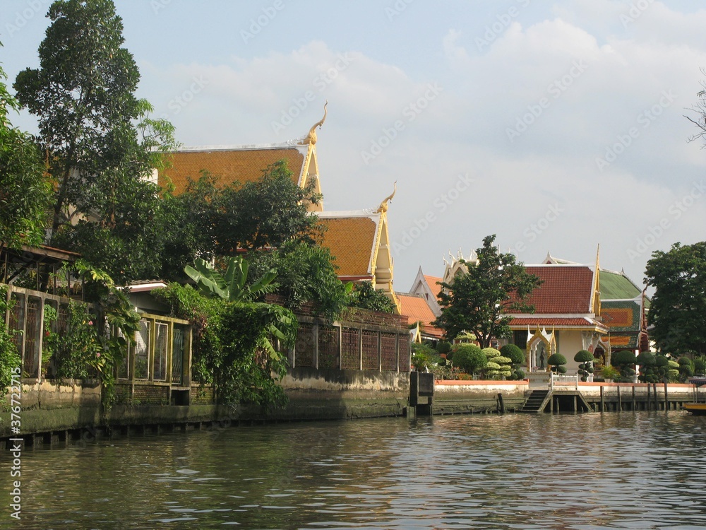 Beautiful view of the houses and the temple at the river