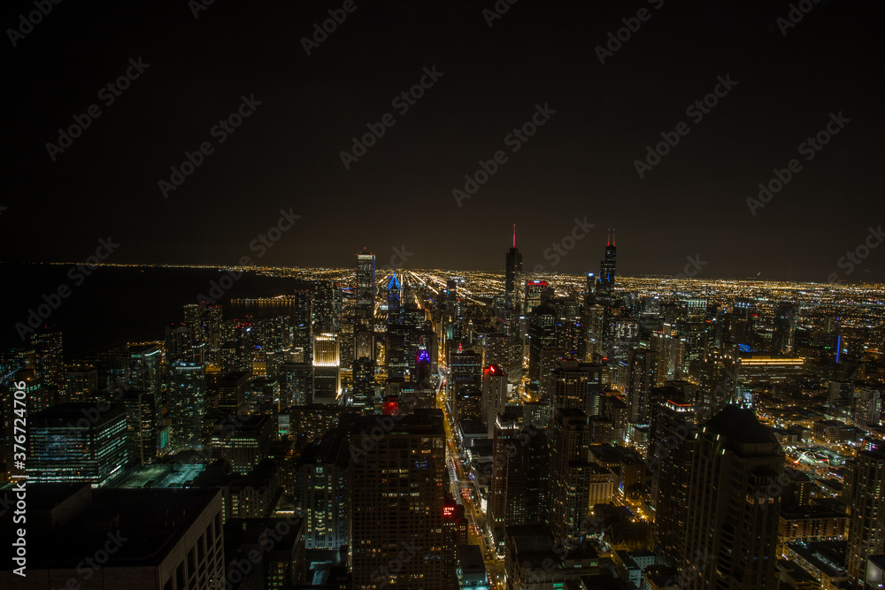 Looking out over the Chicago landscape at night with lights