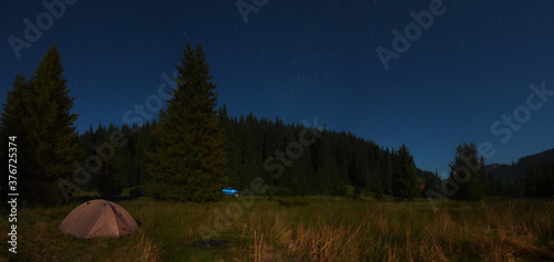 Camping place under the stars into the wild. Panorama with the forests from Frumoasa valley in Sureanu Mountains, Carpathia, Romania. photo