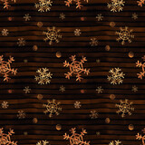 Seamless pattern with golden watercolor snowflakes on dark background.