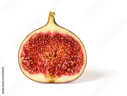 Half of fresh ripe sweet fig fruit isolated on a white background. Sweet fruits and berries. Vegetarian, raw food diet and healthy eating. High resolution image.