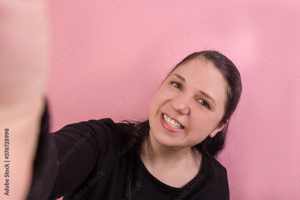 Beautiful and happy brunette takes a selfie Beautiful and happy brunette takes a selfie