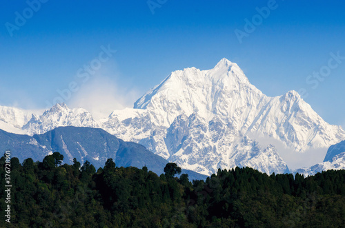 Mount Kanchenjunga range of the himalayas at Sikkim , India photo