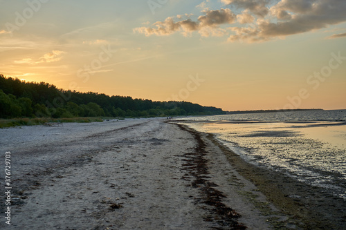 Sunset on the beach with some clouds