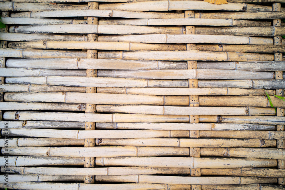 Bamboo sticks wooden background with thread uniting Bamboo sticks wooden background with thread uniting