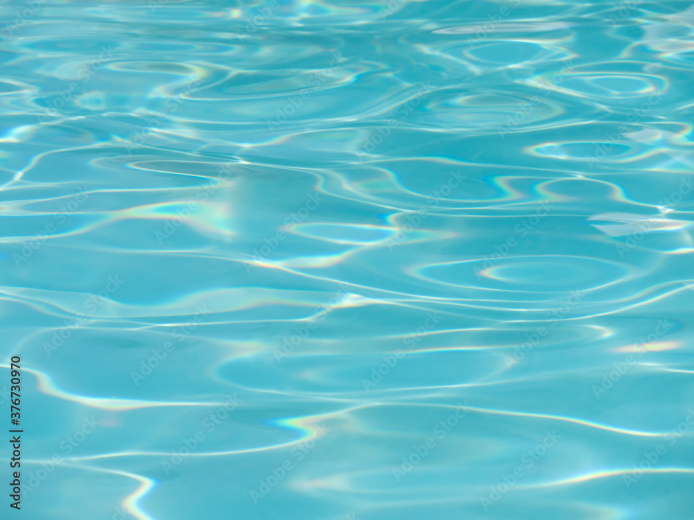 Closeup view of a swimming pool with reflections.