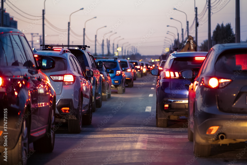 Background, blur, out of focus, bokeh. Traffic jams, road repairs, or accidents. Red brake lights of stopped cars. Background, blur, out of focus, bokeh. Traffic jams, road repairs, or accidents. Red brake lights of stopped cars.