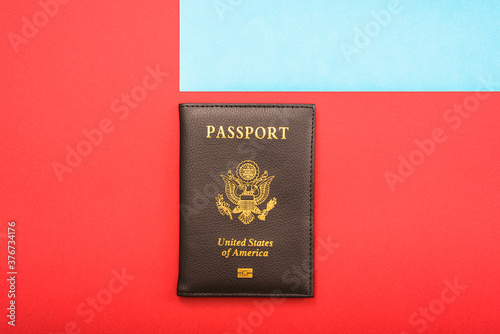 Simple image of an American passport with red and blue background.