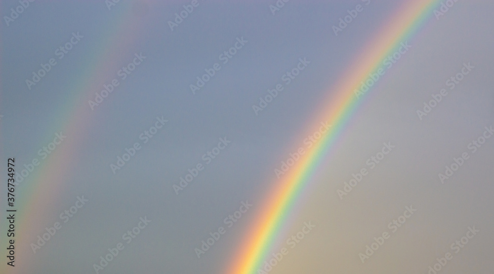 Rainbow in the sky. Concept image. Peaceful nature. Copy space.