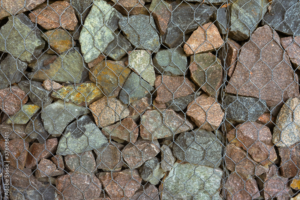 Gabion, texture, background. Wall made of natural rocks and metal fences. Gabion, texture, background. Wall made of natural rocks and metal fences.