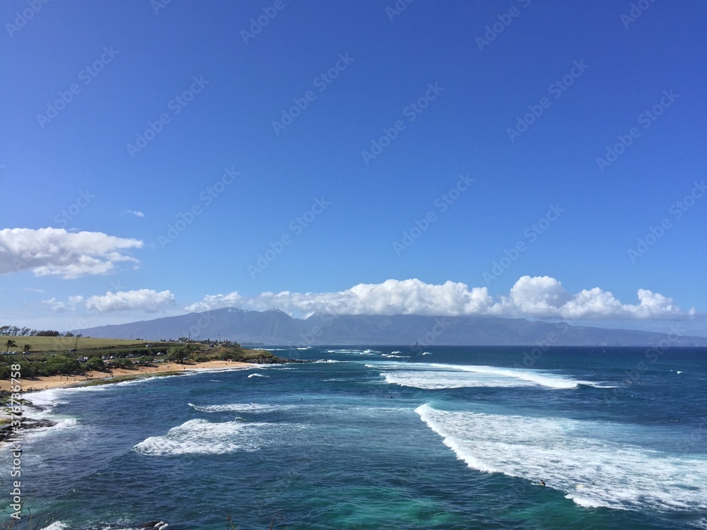 Beach and blue sky with clouds