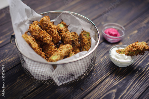 Fried chicken or vegan naggets with two kind of sauce on rustic background. Tasty snacks. Food recipes photo