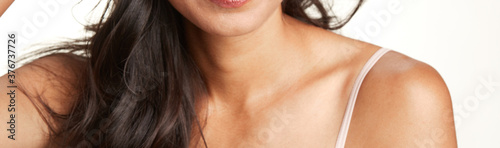 shoulder, chin, neck and arms of Indian women against a white background