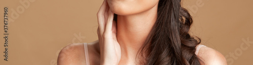 beauty image of flawless skin of women with her hand on her chin