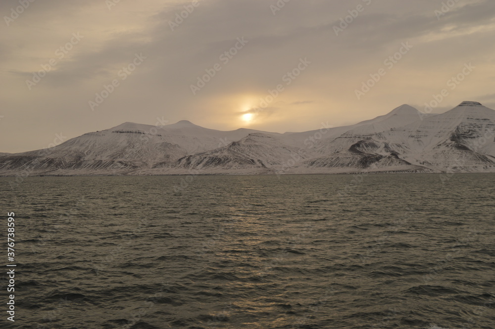 Winter sunset over the ice fjords of the Archipelago of Svalbard (Spitsbergen) in Norway