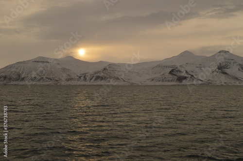 Winter sunset over the ice fjords of the Archipelago of Svalbard (Spitsbergen) in Norway