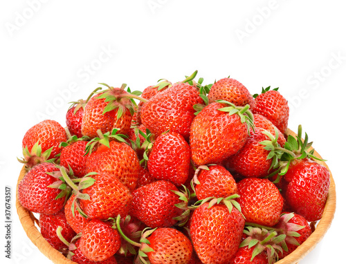 Appetizing strawberry in a basket isolated on a white .