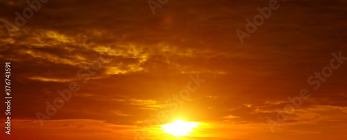 Scenic of the sunrise and cloud on orange sky. Wide photo.