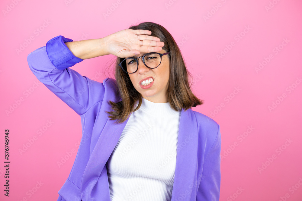 Young beautiful business woman over isolated pink background Touching forehead for illness and fever, flu and cold, virus sick Young beautiful business woman over isolated pink background Touching forehead for illness and fever, flu and cold, virus sick