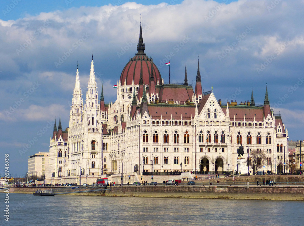 Budapest - Parliament of Hungary by Danube River on a sunny day